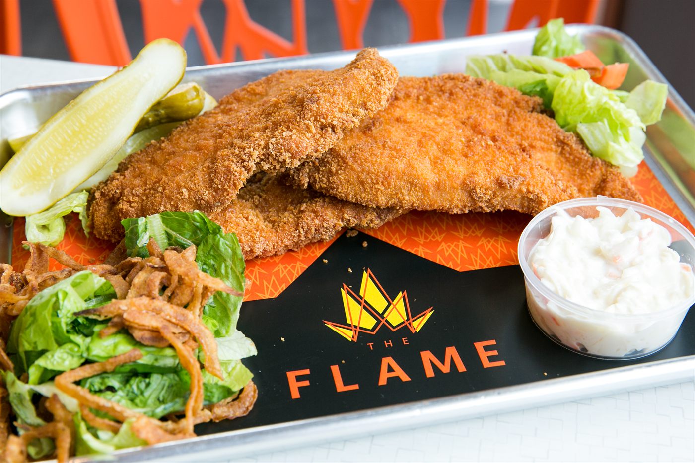 Fried chicken cutlets with coleslaw and pickles
