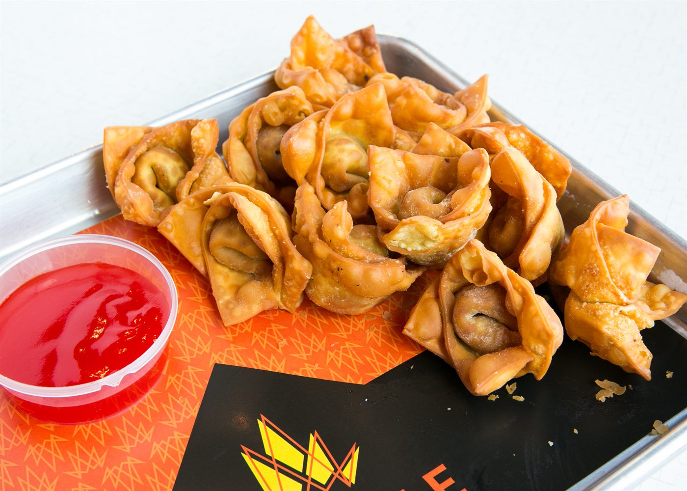 Crispy fried wontons with sweet and sour sauce