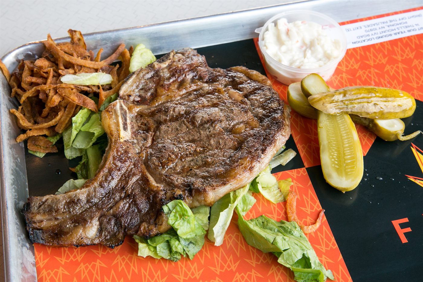 Grilled bone-in rib steak platter