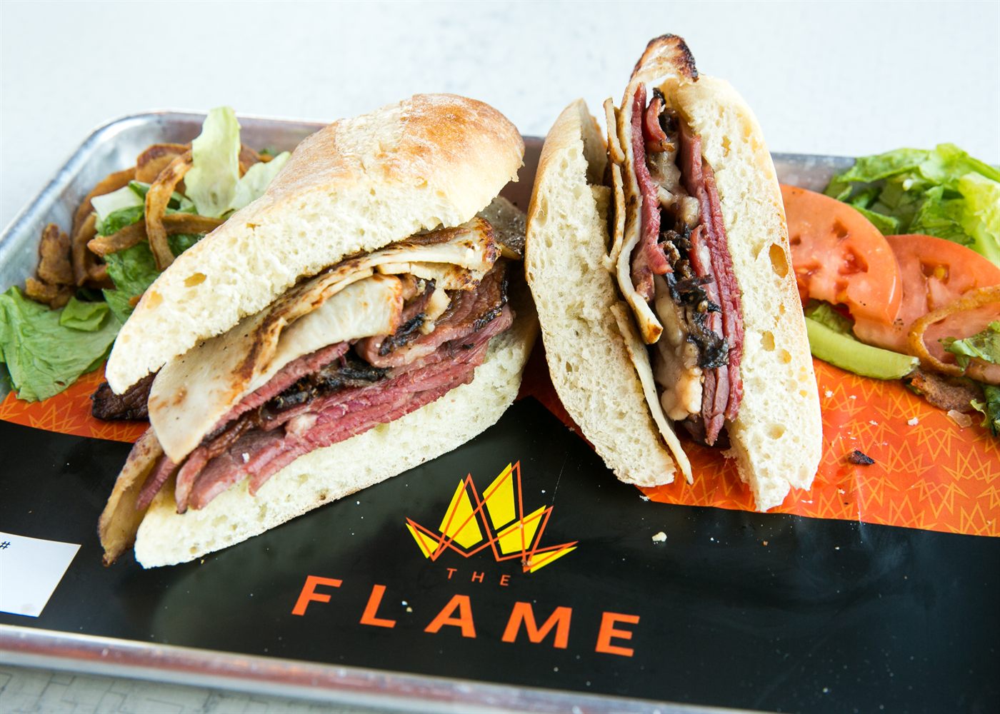 Pastrami and grilled chicken stacked sandwich