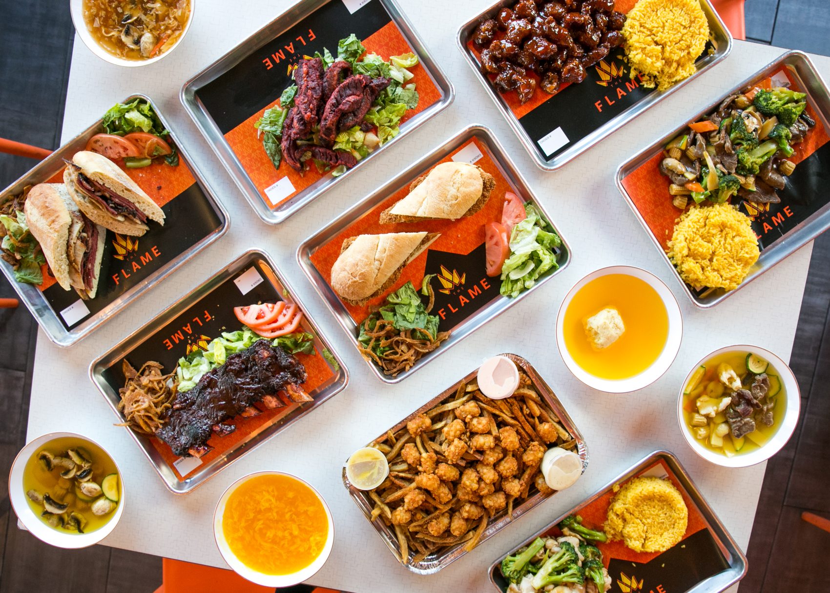 A full spread of The Flame's Glatt Kosher dishes
